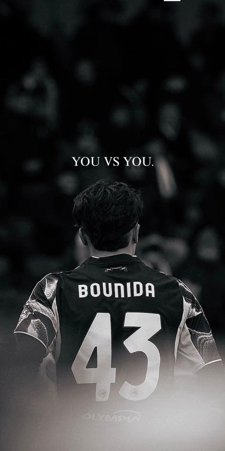 Download this high-quality Rayane Bounida 4K wallpaper featuring the Ajax talent in a black and white "You vs You" edit. This iPhone wallpaper showcases the iconic number 43 jersey with a cinematic smoky finish for a professional look.
