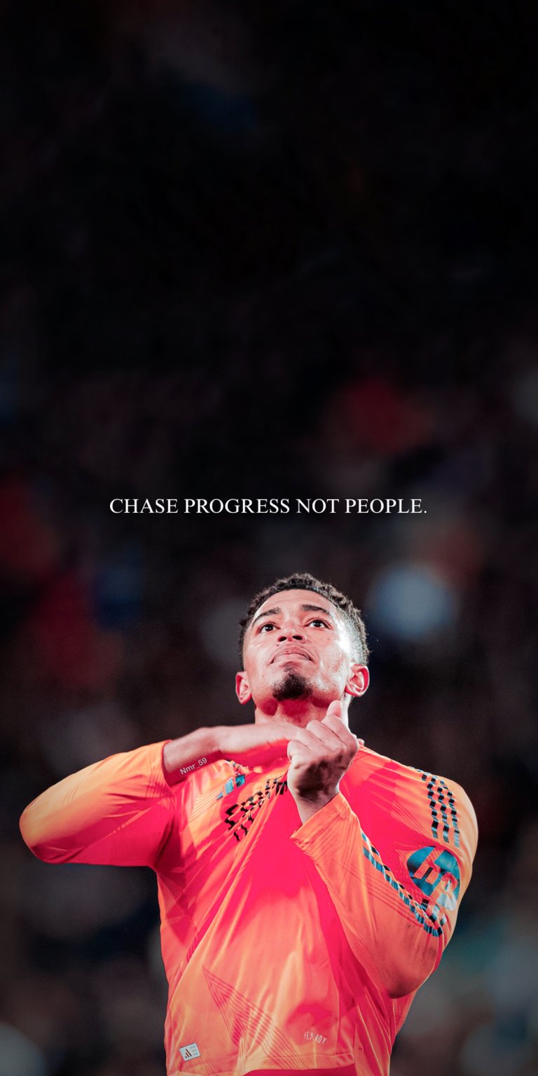 Elevate your iPhone with this Weston McKennie 4K wallpaper, capturing his victorious moment with hands raised. The bright orange long sleeve and clear 'CHASE PROGRESS NOT PEOPLE' quote make this wallpaper truly unique.