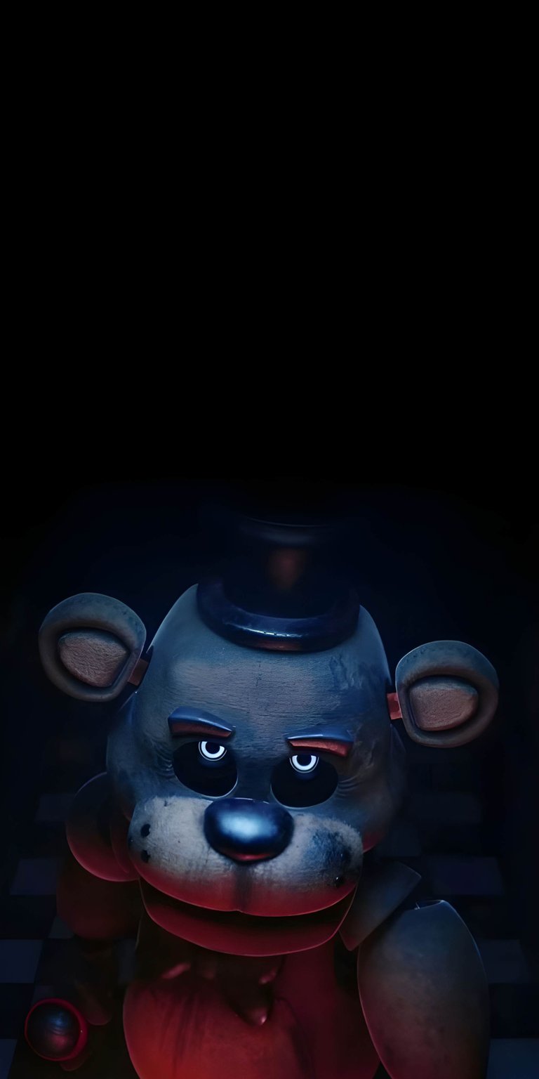 Download this chilling Freddy Fazbear 4K wallpaper for your iPhone! The wallpaper features Freddy in a dark setting with glowing eyes and a small top hat.