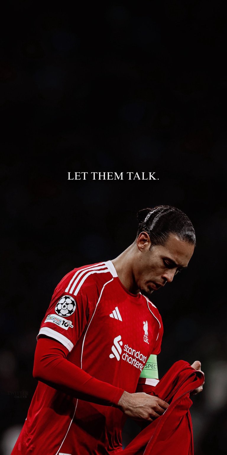 A powerful and intense live wallpaper featuring Liverpool and Netherlands captain, Virgil van Dijk, clutching his iconic red kit. The image is overlaid with the motivational quote, "LET THEM TALK," embodying resilience and focus under pressure. This wallpaper is perfect for fans of VVD, Liverpool FC, and anyone seeking a bold, inspiring, and high-contrast sports aesthetic on their screen.sports, football, soccer, mobile, live wallpaper, iPhone, Android, lock screen, background, fan art, athlete, champion, HD, game day.