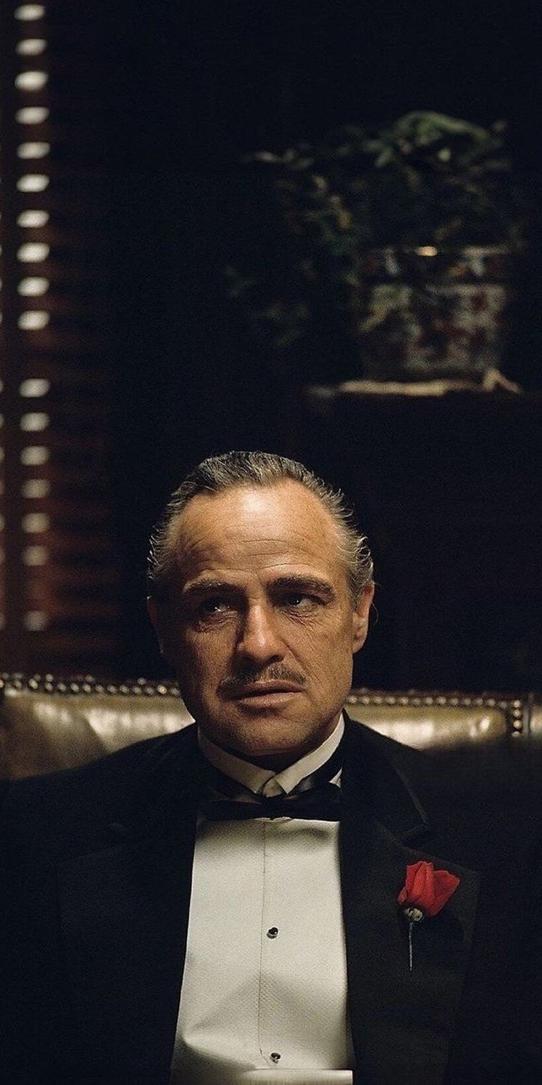Don Corleone in suit sitting wallpaper in 4k