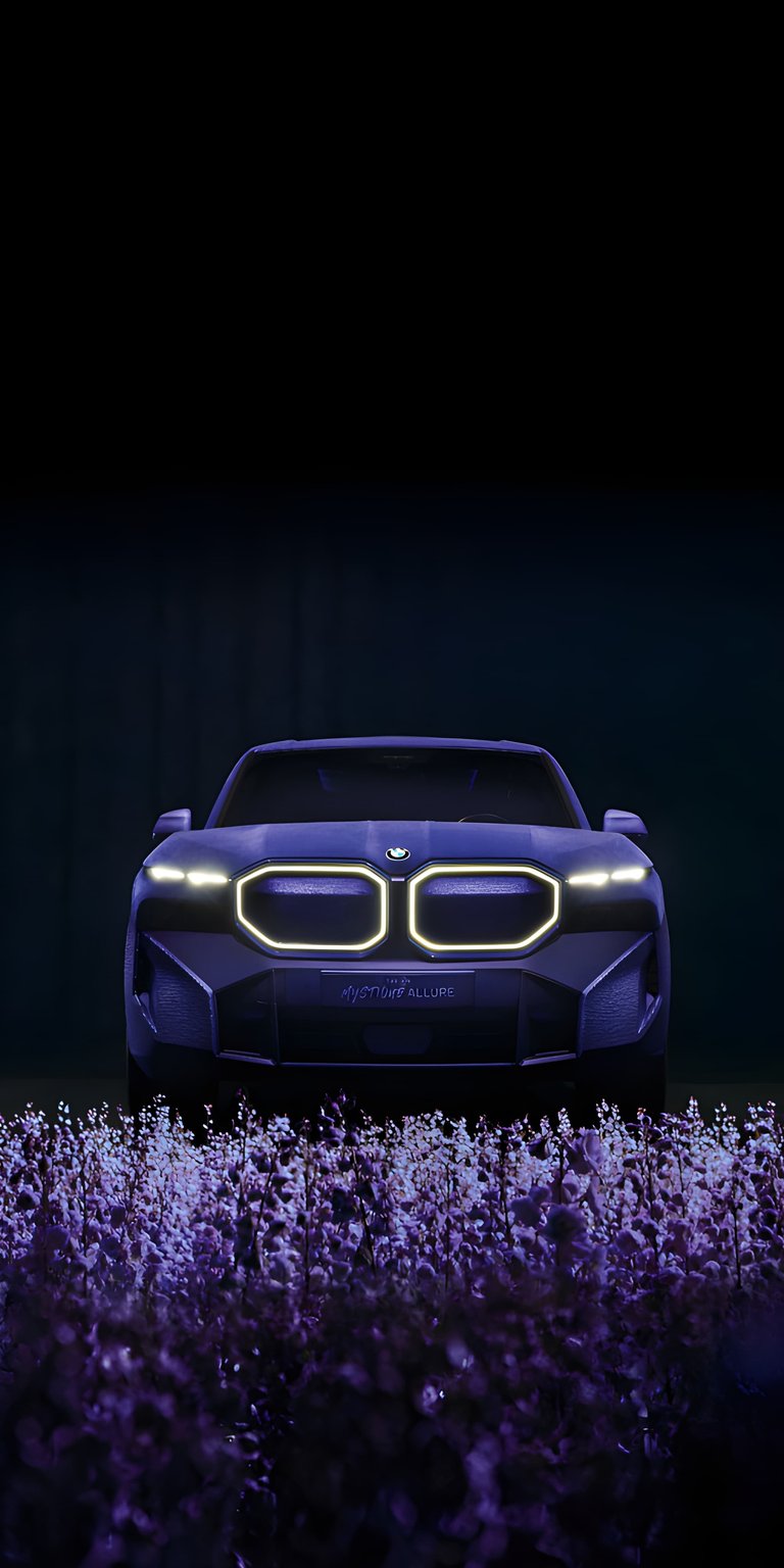 This BMW XM Mystique Allure 4K wallpaper brings a cinematic and moody aesthetic to your iPhone. The wallpaper features a deep purple textured finish and glowing contour kidney grilles set against a field of lavender flowers.