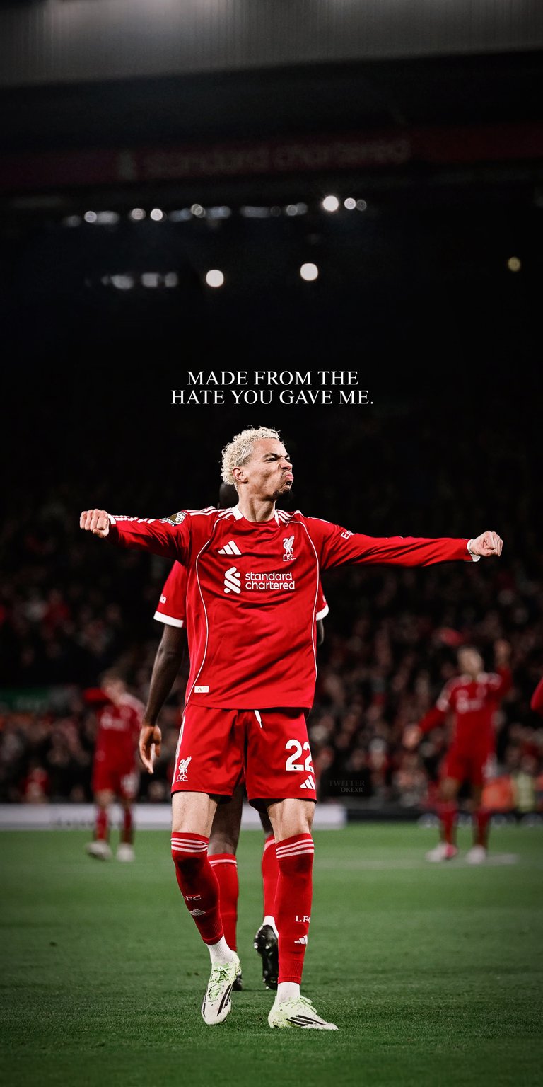 Get this stunning ekitike 4K wallpaper for your iPhone, showing him in his red kit with striped socks. The wallpaper also showcases the phrase "MADE FROM THE HATE YOU GAVE ME."