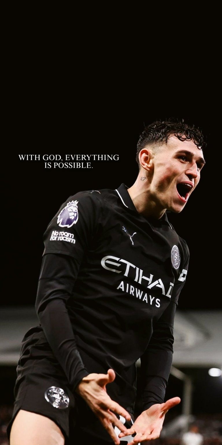 A sharp, emotive image of Phil Foden in the Manchester City black away kit, capturing his passionate celebration. With the text "WITH GOD, EVERYTHING IS POSSIBLE," this wallpaper highlights the Manchester City star’s skill and dedication.
