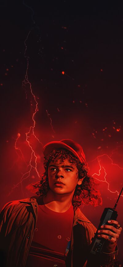 Download this Stranger Things matching wallpaper in stunning 4K for your iPhone. Witness Dustin using his walkie-talkie amidst a backdrop of fiery red lightning.