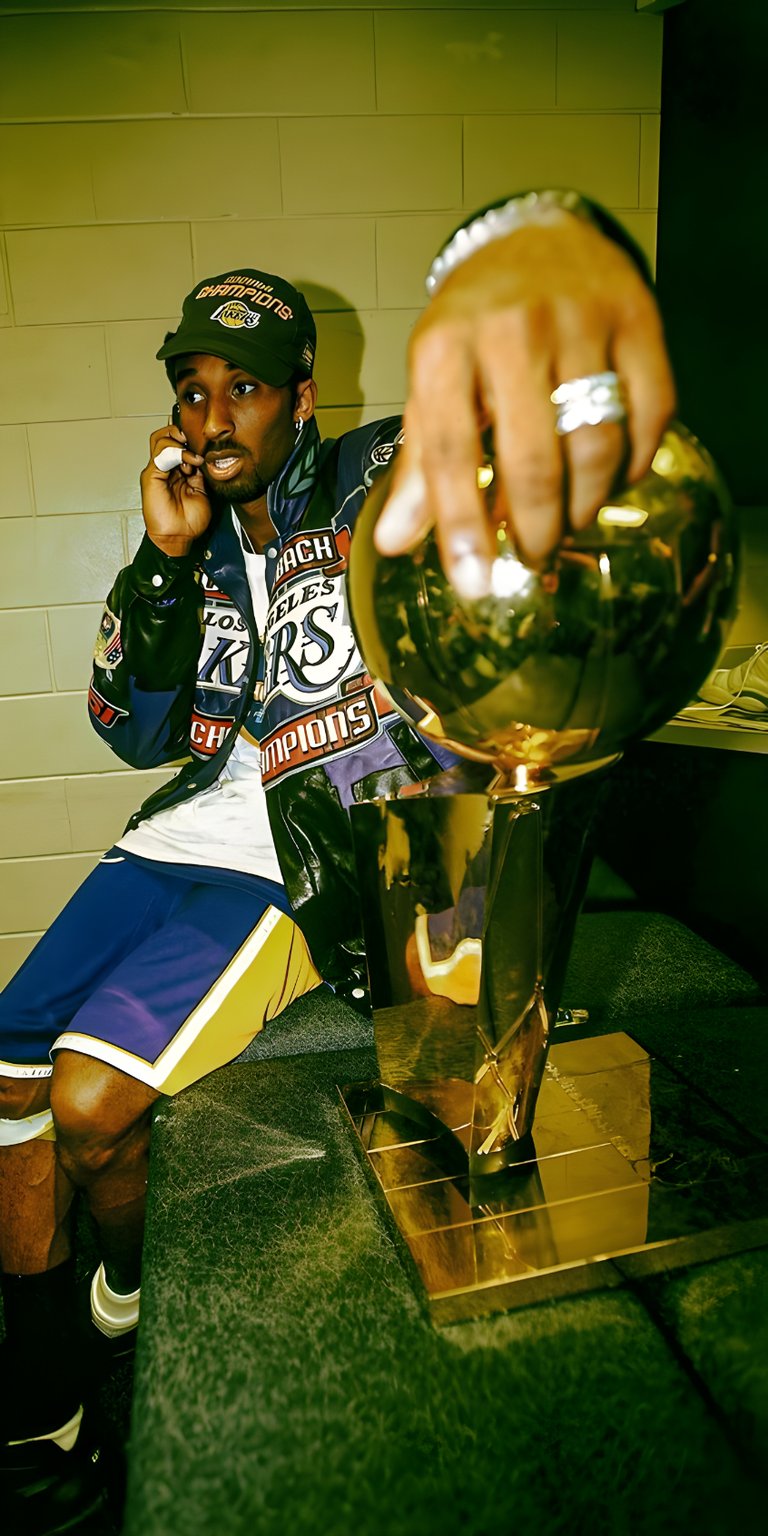 Kobe Bryant with his  championship trophy wallpaper 4k phone
