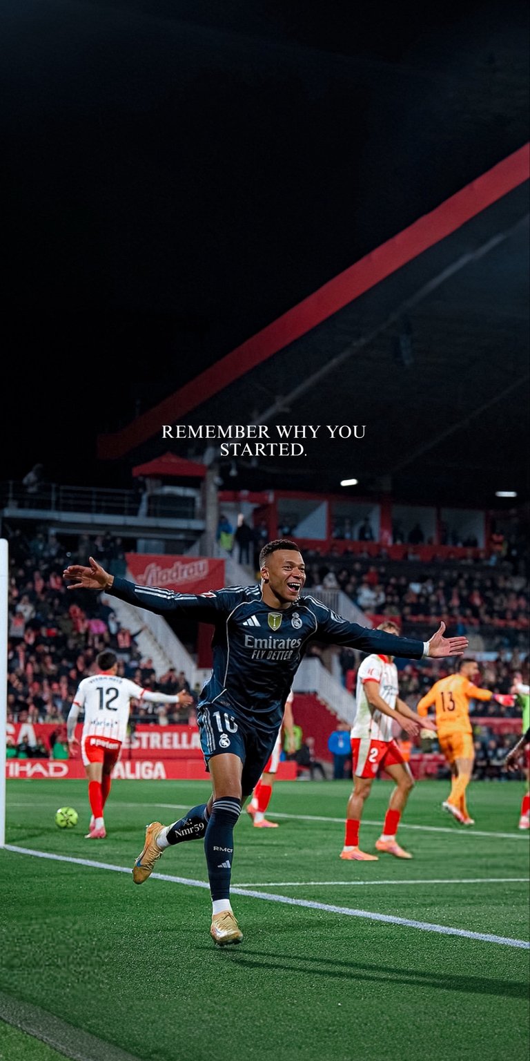 An epic live wallpaper capturing the dynamic goal celebration of Real Madrid forward Kylian Mbappé on the pitch. Featuring the inspiring text "REMEMBER WHY YOU STARTED", this intense, atmospheric scene is perfect for football fans seeking motivation and a classic sports aesthetic on their home screen.