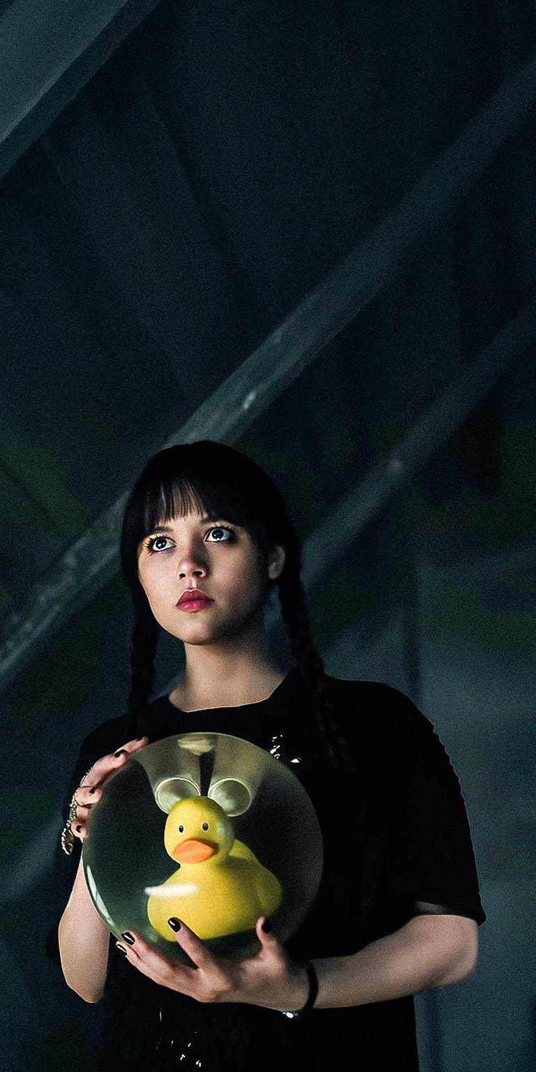 Wednesday Addams holding a ducky wallpaper iPhone 4K
