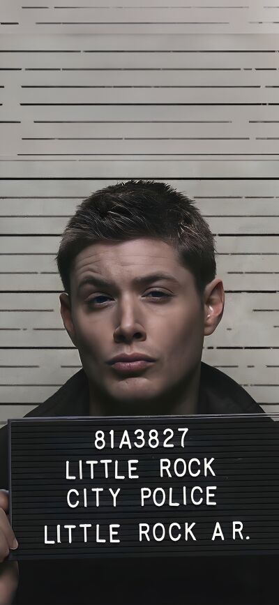 This 4K wallpaper features Sam and Dean Winchester with a sign written "Little Rock City Police" for iPhone. This matching wallpaper is perfect for Supernatural fans who want to share a fun image across two phones.