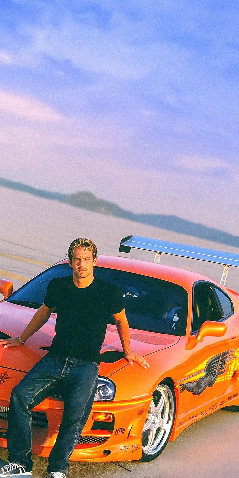 Paul Walker sitting on the hood of Toyota Supra car wallpaper