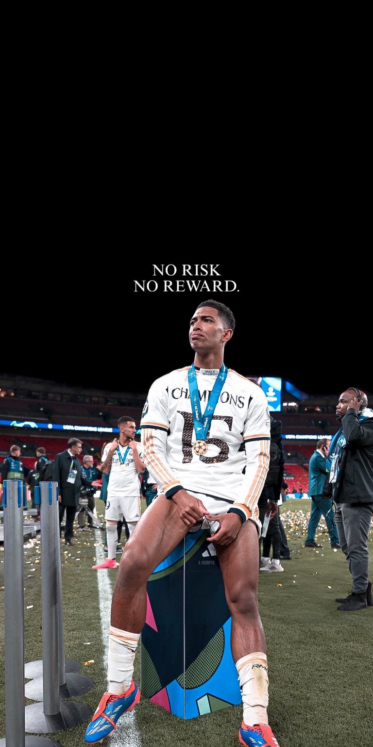 Jude Bellingham standing confidently in a white football kit with stadium background and bold motivational text. This 4K wallpaper delivers sharp contrast and powerful presence for iPhone, designed in a dark aesthetic wallpaper style.