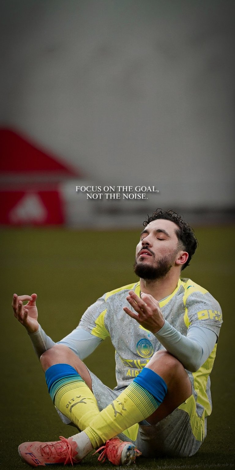 Capture the calm intensity of Manchester City’s French magician, Rayan Cherki. This wallpaper features his signature "Zen" meditation celebration in the sky blue City kit. The design uses a soft-focus stadium background to highlight the creative midfielder in stunning 4K detail.