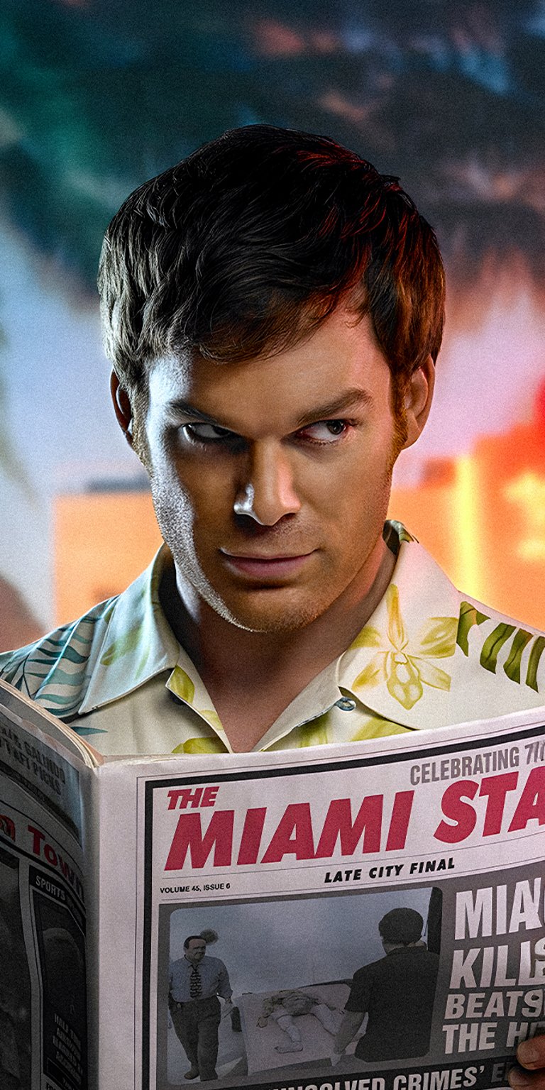 Dexter Morgan reading newspaper with side eye look wallpaper