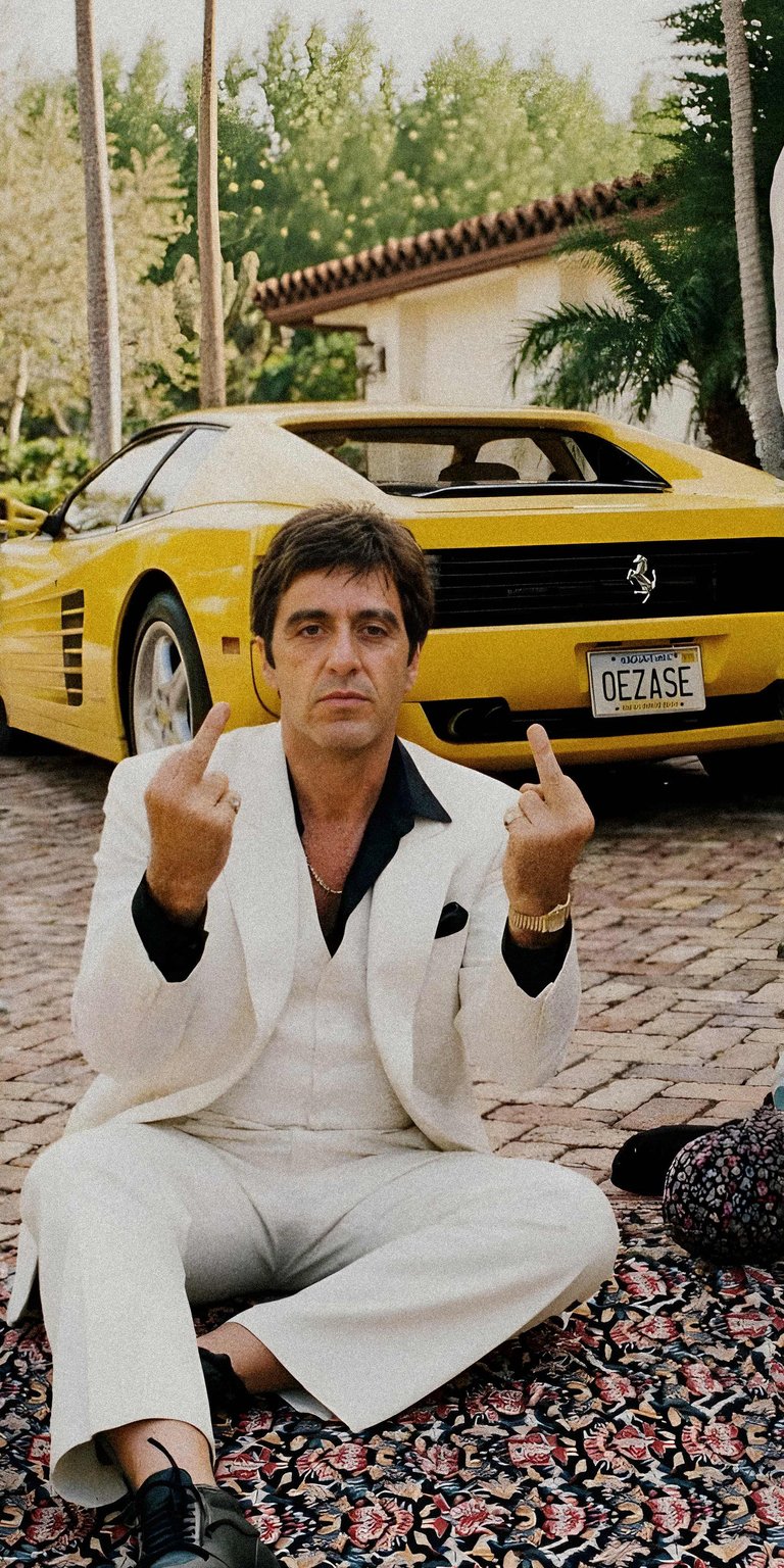 Tony Montana 4K wallpaper featuring a cinematic scene with a confident pose and luxury car backdrop. This aesthetic wallpaper showcases bold attitude, sharp contrast, and dramatic lighting, making it perfect for iPhone lock screen and home screen setups.