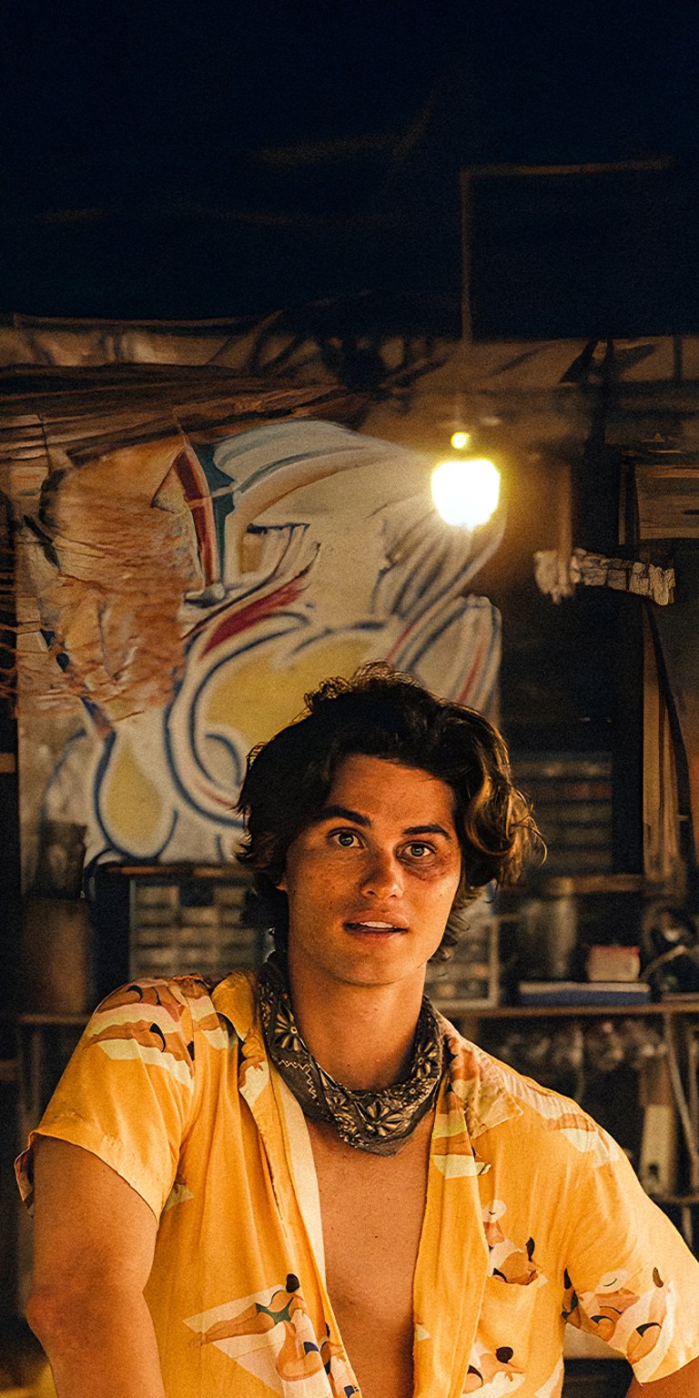 John B hawaiian outfit in a bar wallpaper