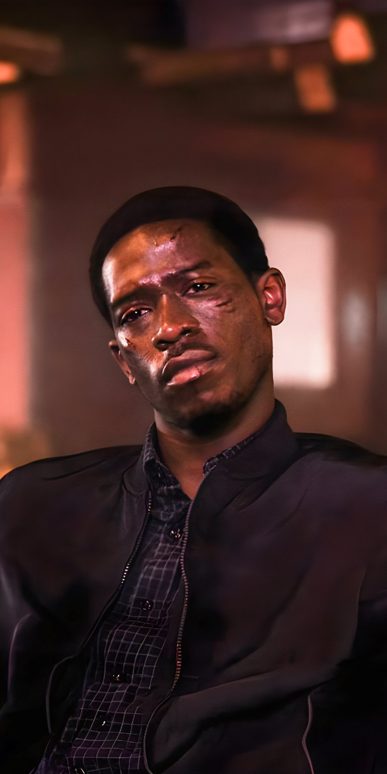 Franklin Saint in black suit sitting wallpaper