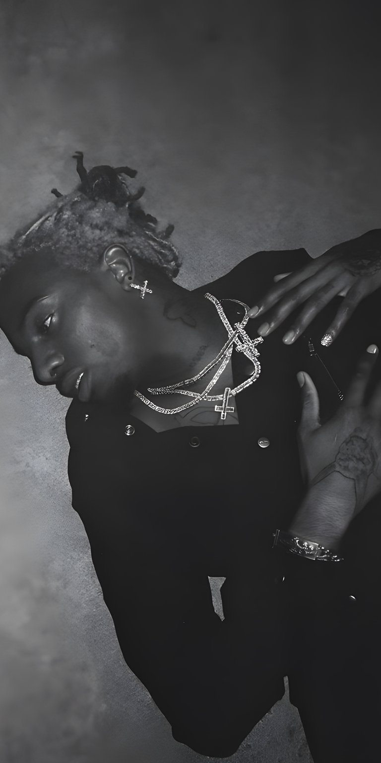 Carti lying down with cross accessories black and white wallpaper