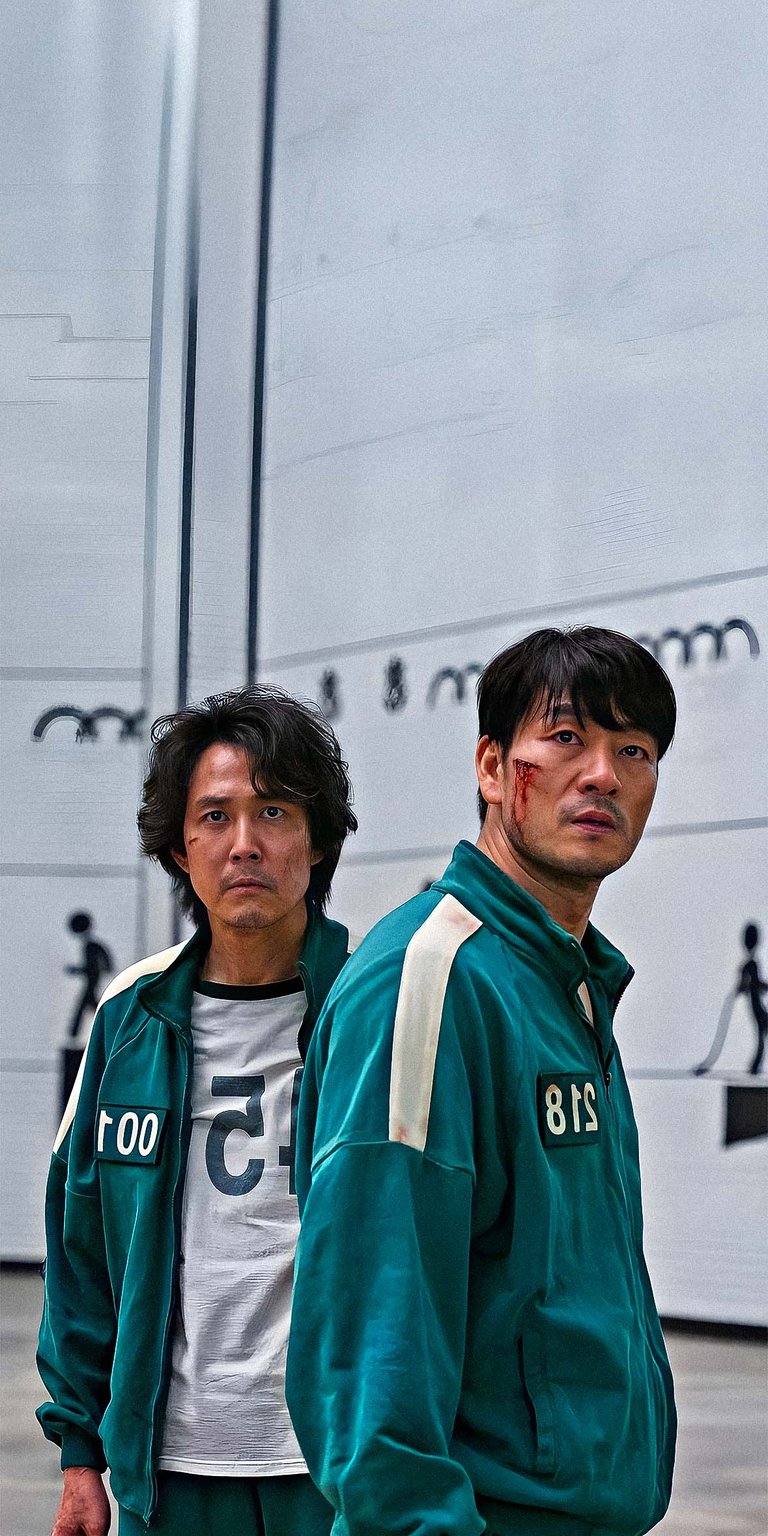 Seong Gi-hun player 456 and Cho Sang-woo player 218 standing together wallpaper