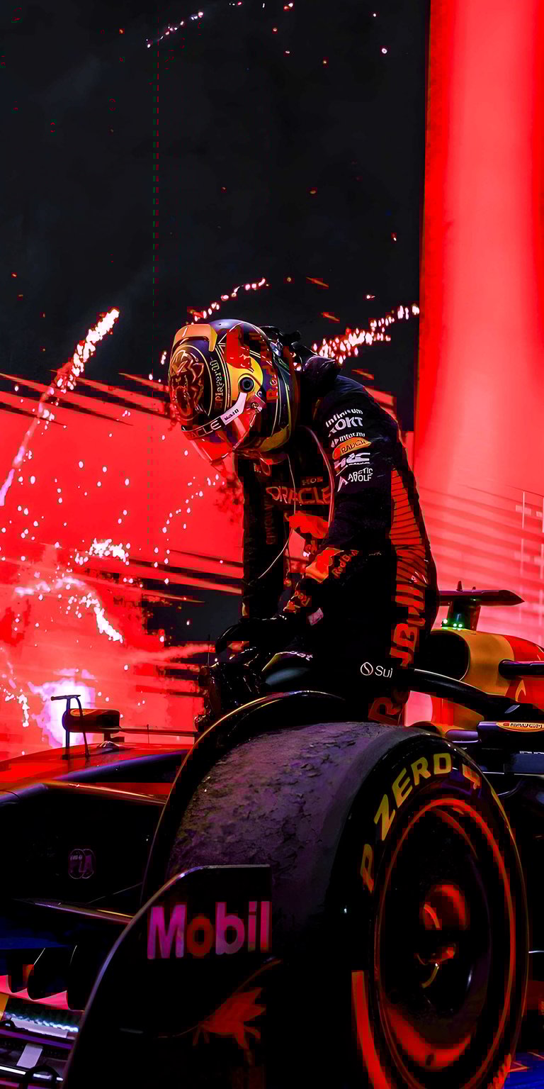 Get this Sergio Perez 4K wallpaper for your iPhone, featuring a red-lit racing suit and distinctive helmet design. This stunning wallpaper highlights the "Mobil" logo on the tire of a formula 1 car, creating a visually striking image.