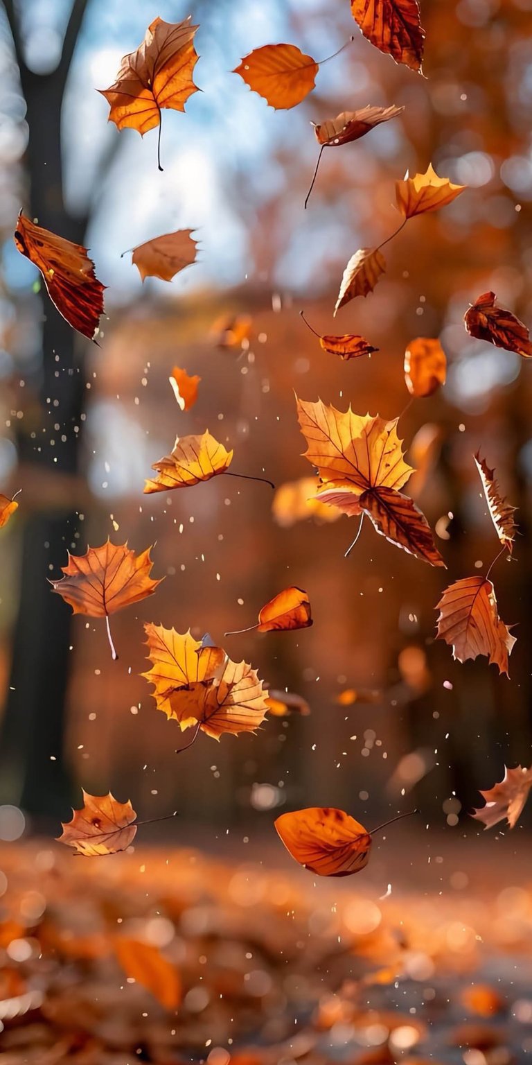 Enhance your iPhone with this vibrant Aesthetic wallpapers choice featuring golden leaves dancing in the wind. This high-resolution wallpaper captures warm amber tones and a soft bokeh depth of field for a cozy seasonal mood.