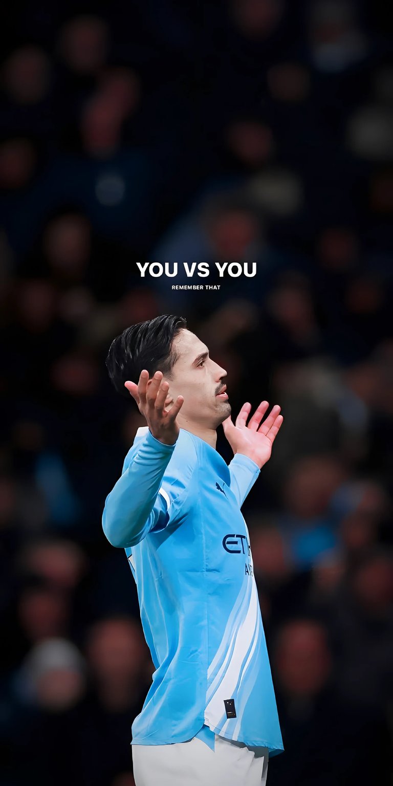 This striking 4K wallpaper features midfielder Tijjani Reijnders in his sky-blue kit, looking upward with a determined expression. The centerpiece is the bold, minimalist text "YOU VS YOU," emphasizing personal growth and internal competition. The dark, moody lighting makes it an excellent choice for a clean and focused lock screen.