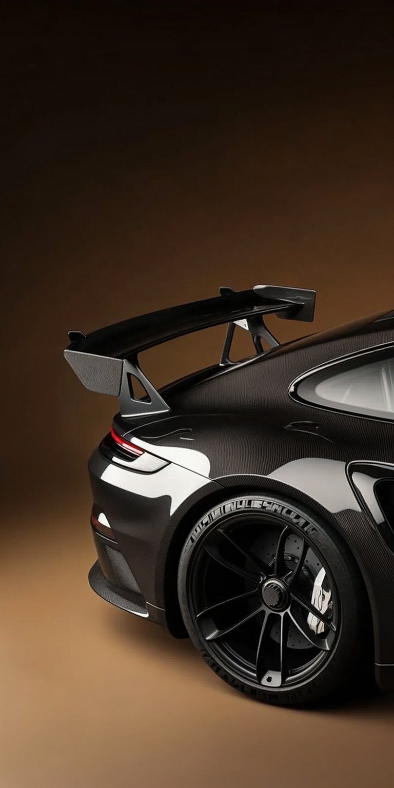 Get this awesome Porsche 911 GT3 wallpaper for your iPhone in stunning 4K resolution! The carbon fiber body, large rear wing, and low-profile tires make this wallpaper pop.