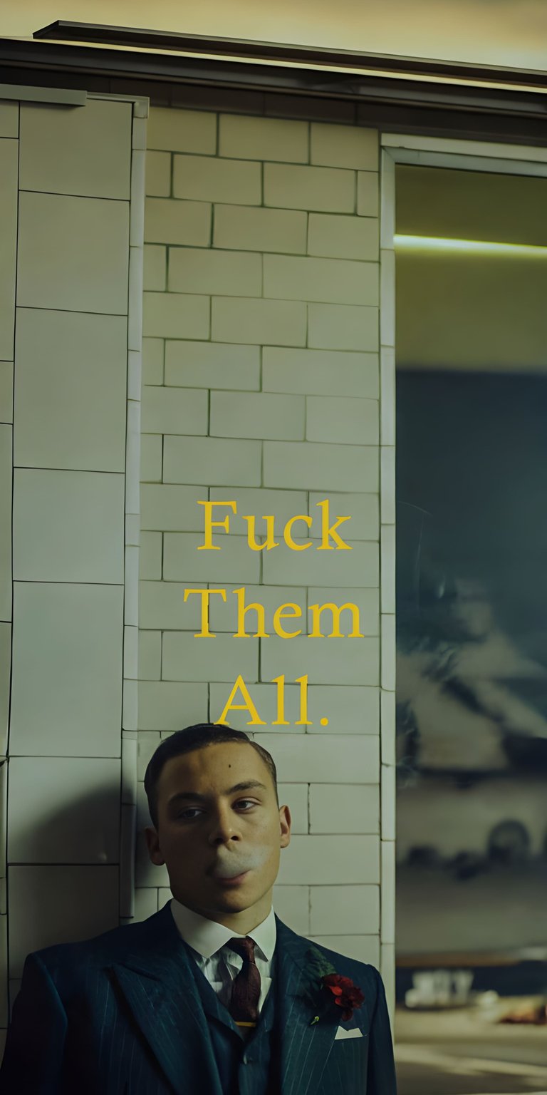 Download this impressive Finn Cole 4K wallpaper for your iPhone, showcasing him in a sharp suit and a crimson flower pinned to his lapel. This striking wallpaper features a bold yellow text overlay.