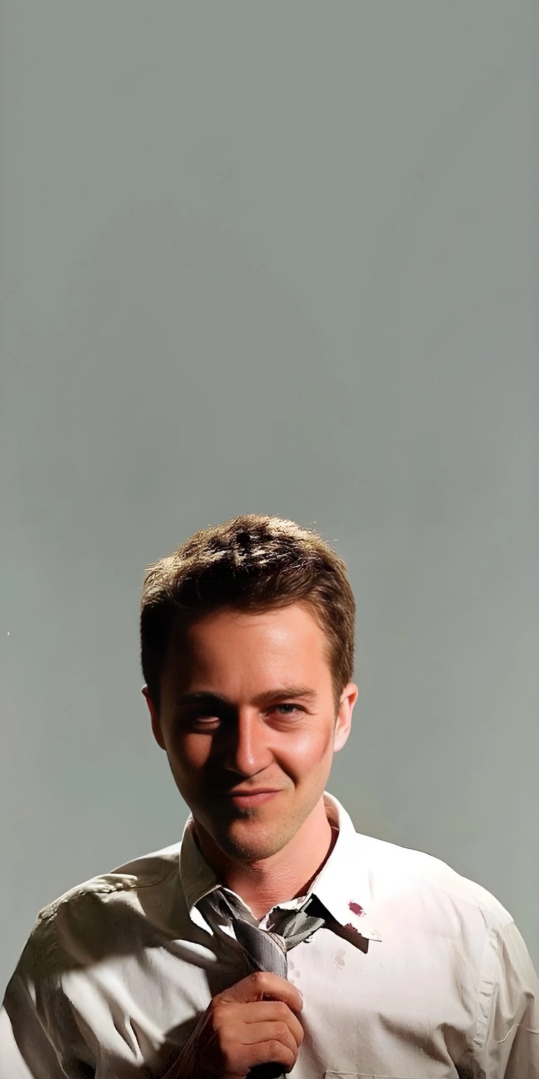 Download this Edward Norton 4K wallpaper for your iPhone, showcasing his confident smirk, disheveled tie, and the subtle stain on his shirt. This incredible wallpaper captures the essence of his iconic presence.
