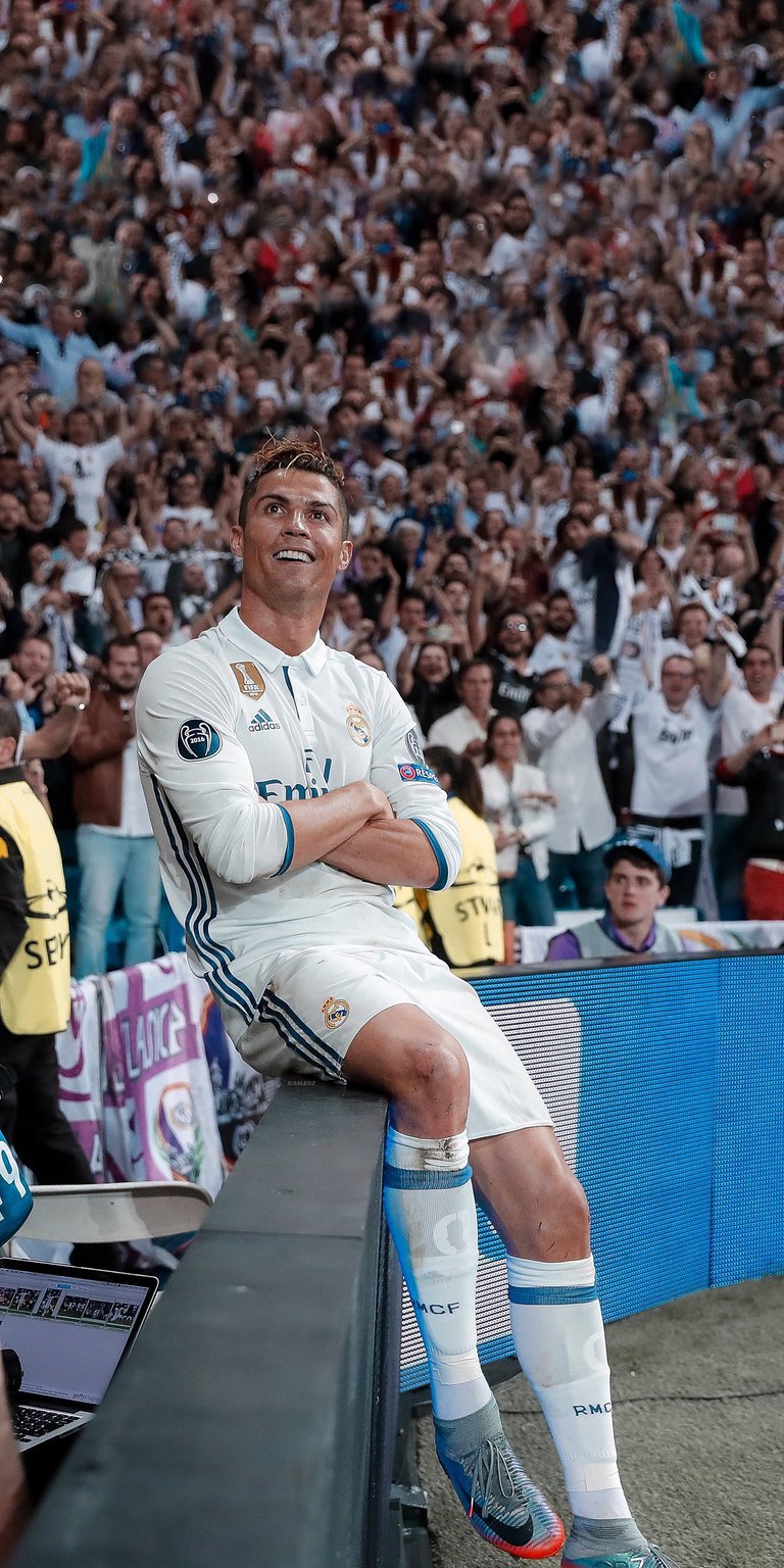 Cristiano Ronaldo sitting at the side of the field wallpaper