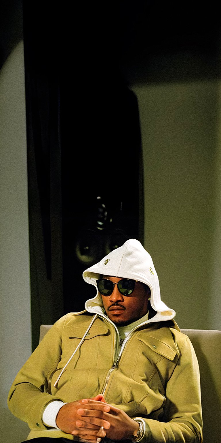 Future wearing a hood while sitting wallpapers