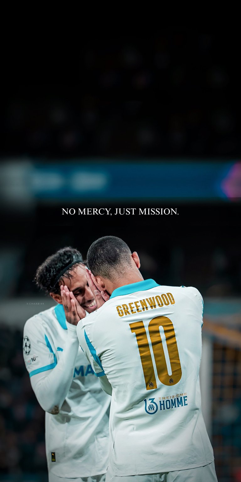 A powerful tribute to a football legend! This live wallpaper features the iconic athlete Lionel Messi in his white team kit, accompanied by the motivational quote, "NO MERCY, JUST MISSION." The image captures the intensity and focus of the GOAT, making it a perfect backdrop for any fan. Ideal for showing your support and keeping your drive strong. Elevate your phone's look with this essential wallpaper for any true football enthusiast!