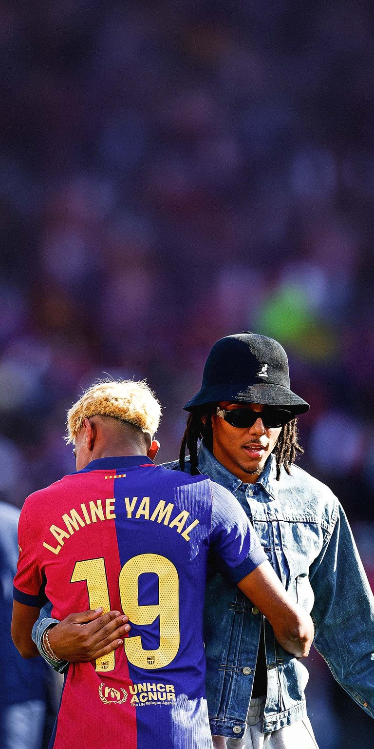 Lamine Yamal and Jules Kounde of FC Barcelona celebrating the victory Wallpaper