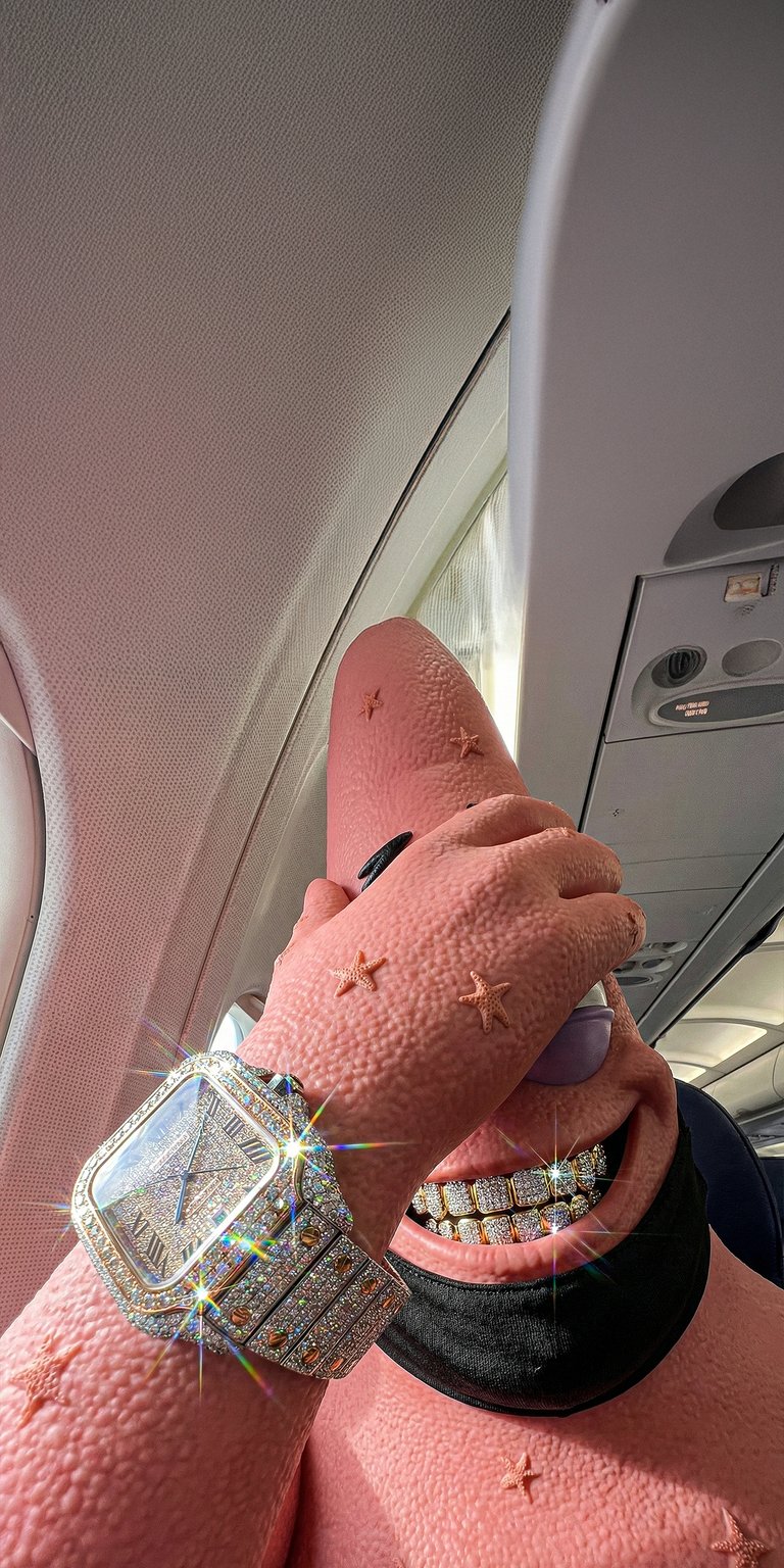 This 3D Patrick Star wallpaper showcases a luxury "iced out" look featuring a diamond watch and grillz inside an airplane cabin. Perfect for your iPhone, this aesthetic wallpaper captures hyper-realistic textures and sparkling light glints for a high-status vibe.