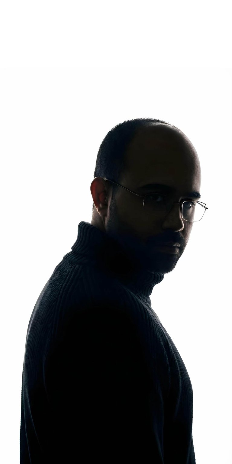 This Danny Slicer wallpaper captures the viral creator's iconic look in a sharp, high-contrast silhouette for iPhone. A perfect aesthetic wallpaper for fans, it features a clean white backdrop and detailed side-lighting that highlights his signature turtleneck and glasses.