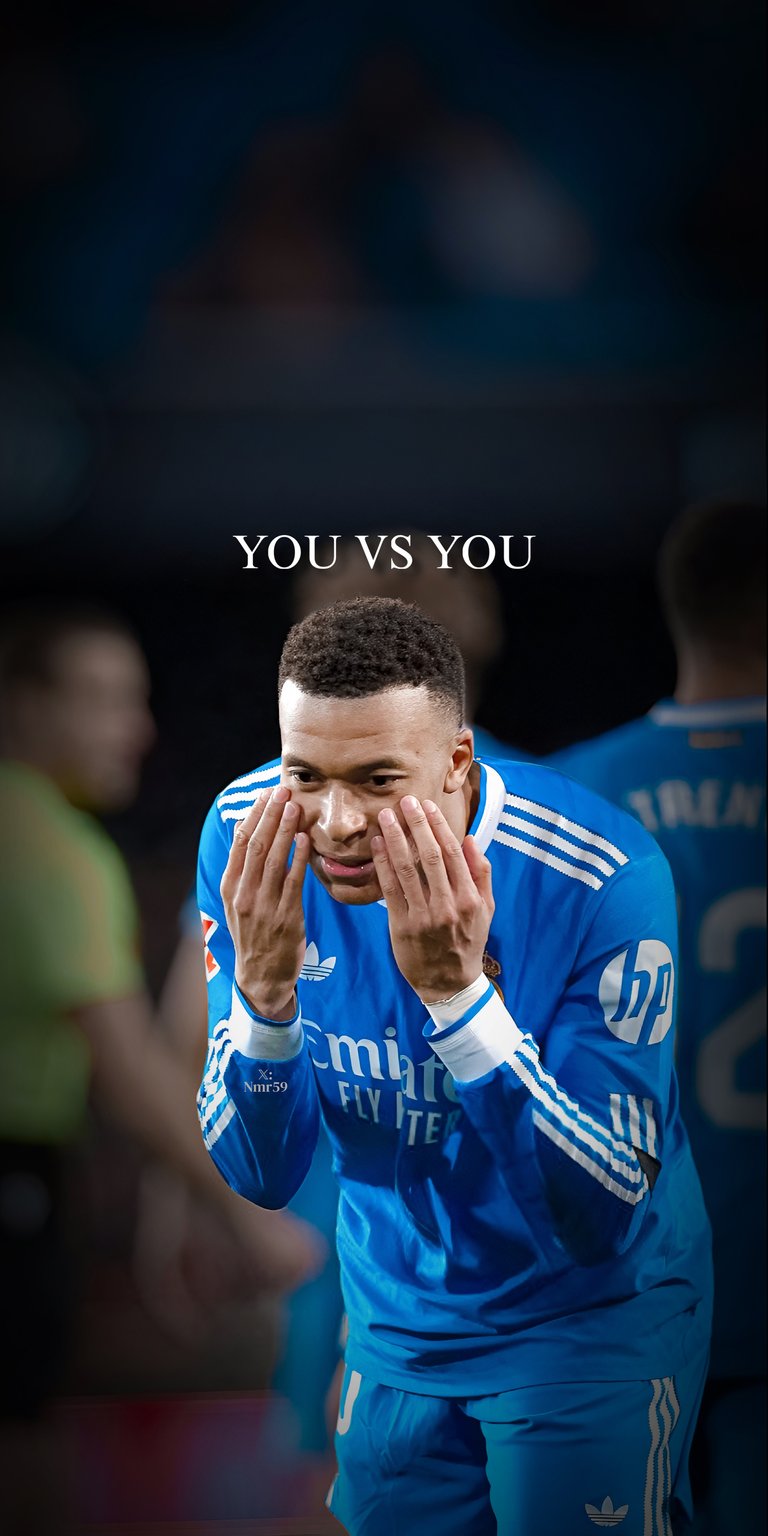 Download this incredible Kylian Mbappe 4K wallpaper for your iPhone, showcasing him in a blue long sleeve jersey with white stripes. This unique wallpaper captures the intensity of the player's focus.