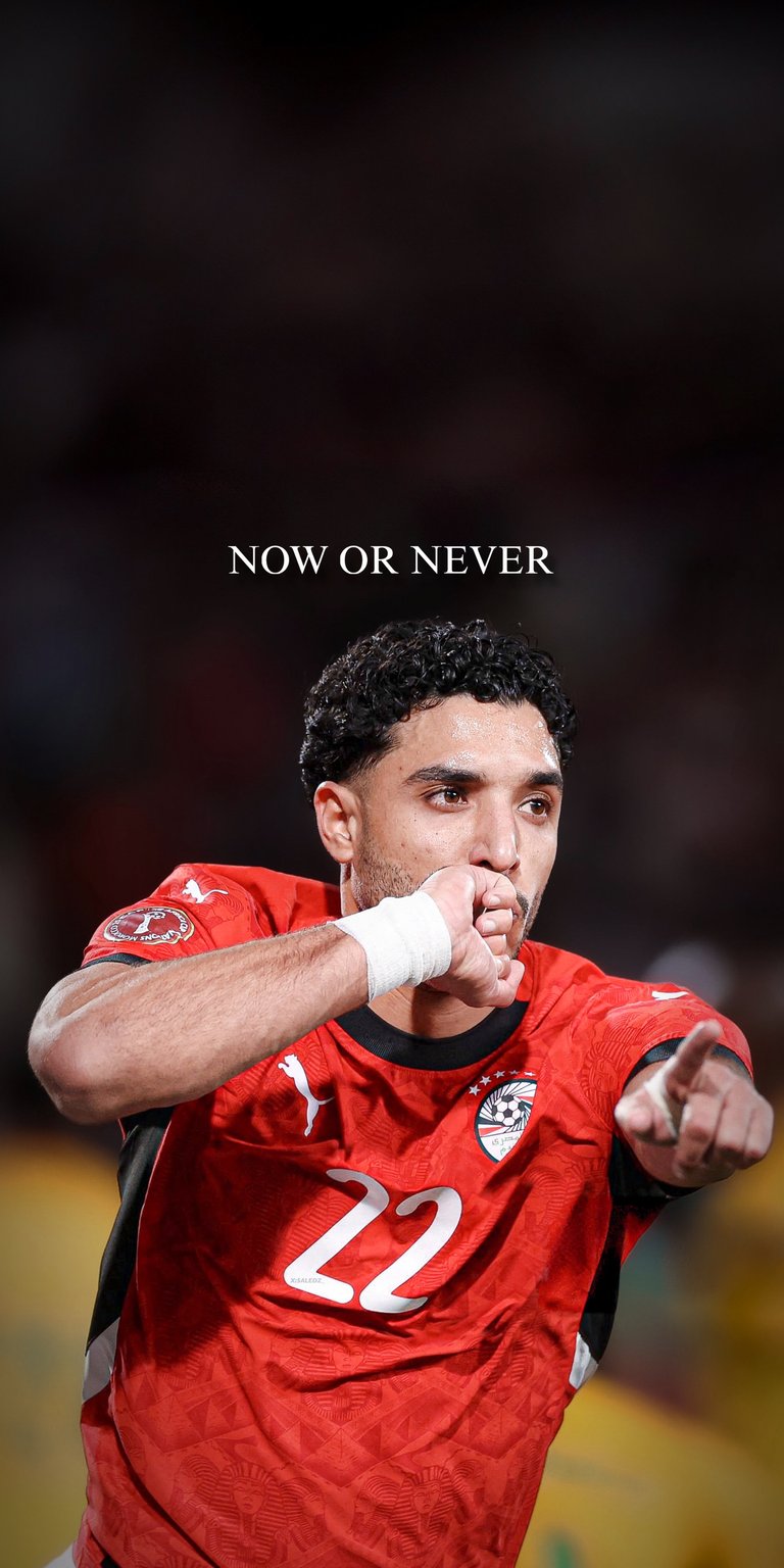Celebrate Egyptian talent with this 4K wallpaper of Omar Marmoush. The image captures him in the vibrant red Egypt national team kit during a moment of celebration. The dark, atmospheric background and the "NOW OR NEVER" quote make this a standout piece for fans following the Bundesliga star’s international journey.