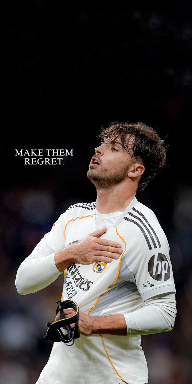 Download this high-quality Raul Asencio 4K wallpaper featuring the Real Madrid star in a moment of intense passion. This stunning 4K wallpaper is perfectly optimized for your iPhone screen, capturing the player clutching the club crest while wearing a protective mask.