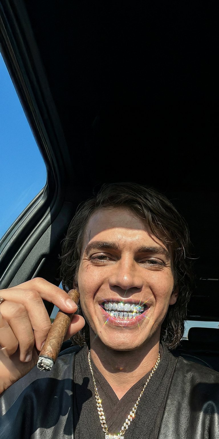 Upgrade your iPhone with this high-contrast Anakin Skywalker OLED wallpaper featuring a unique "iced out" look with diamond grills and jewelry. This 4K wallpaper captures a bold, cinematic mood with deep black shadows and brilliant sparkling highlights.