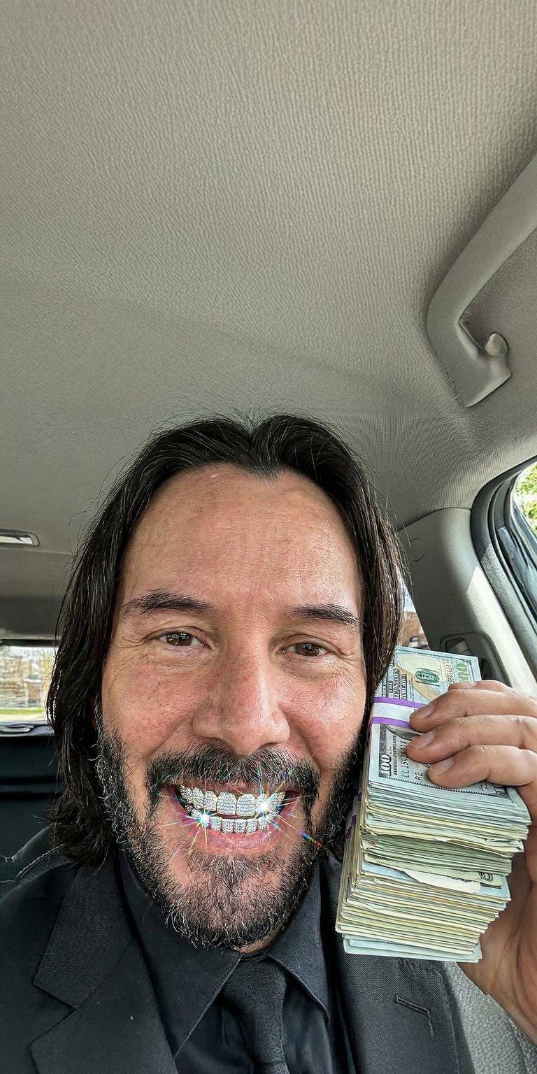 This 4K aesthetic wallpaper features Keanu Reeves posing with a massive stack of cash and iced-out diamond grillz. Perfect for your iPhone, this wallpaper captures a wealthy, humorous mood with soft interior car lighting and brilliant jewelry glints.