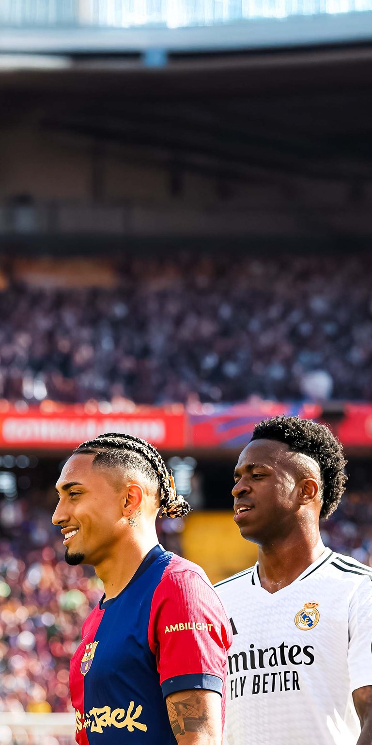 Raphinha Dias and Vinicius Junior play during the match between FC Barcelona and Real Madrid Wallpaper
