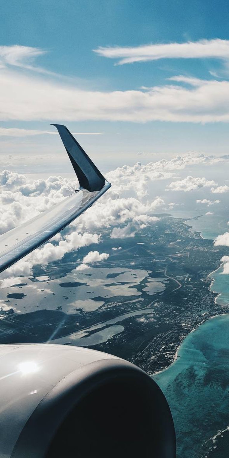 Airplane flying above the clouds wallpaper