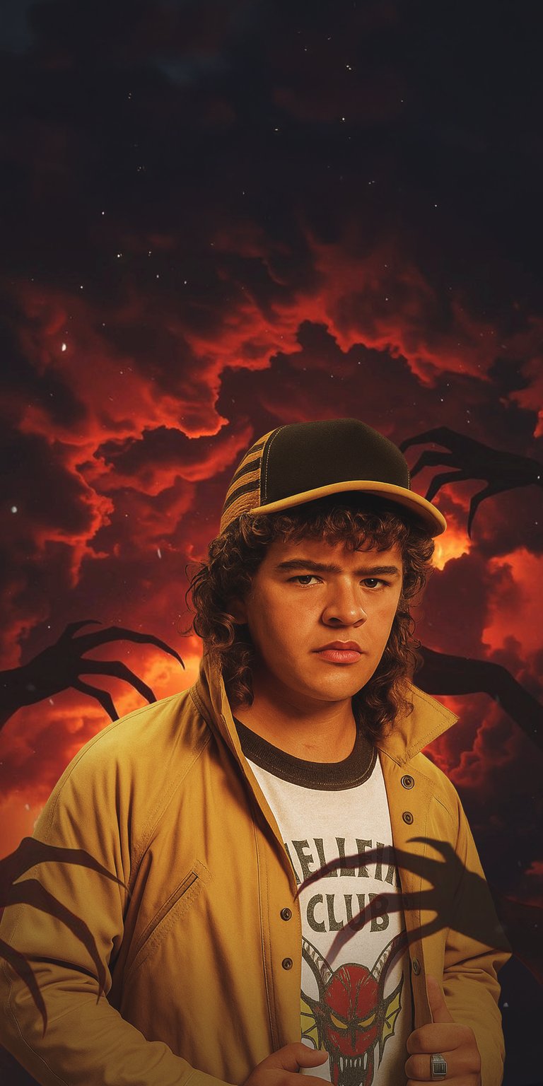 Download this high-quality Dustin from Stranger Things wallpaper in 4K for your iPhone, featuring a backdrop of fiery red clouds and spooky reaching hands. This striking wallpaper showcases Dustin wearing his iconic cap and Hellfire Club t-shirt.