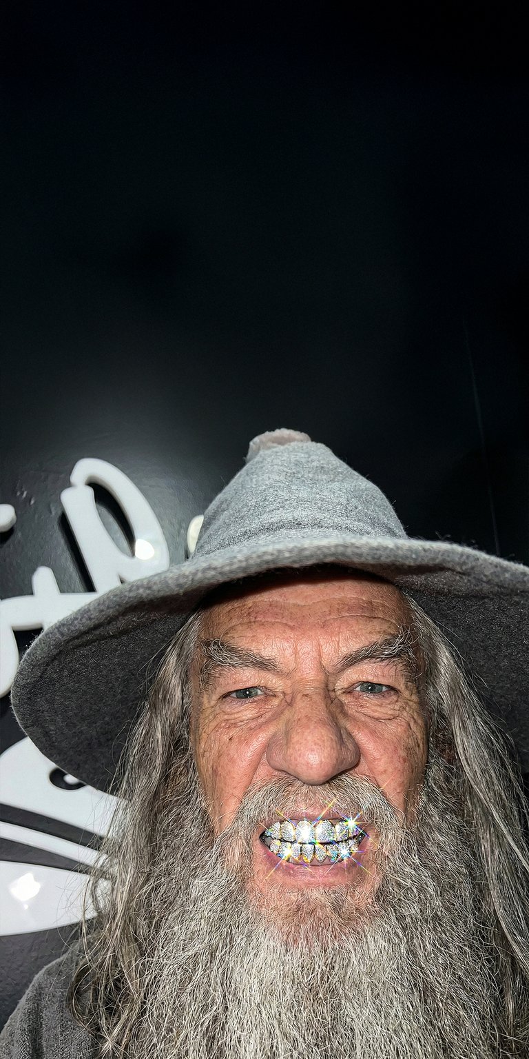 This striking 4K OLED wallpaper features a high-contrast close-up of Gandalf sporting sparkling diamond grillz against a deep black background. Perfect for your iPhone, this wallpaper combines cinematic detail with bold lighting and an edgy, modern mood.