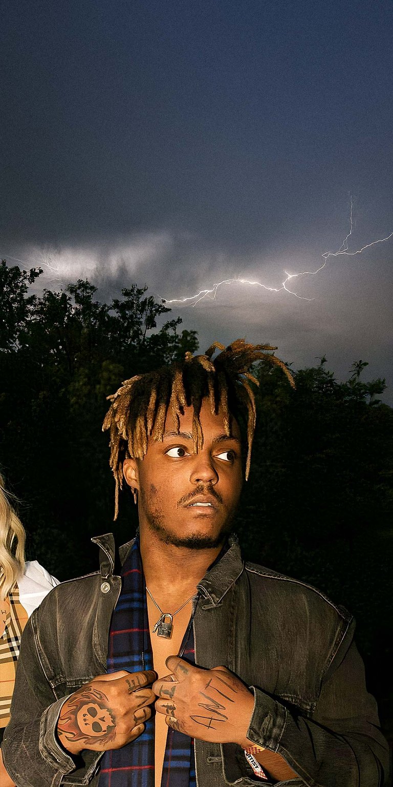 Juiceworld in a thunder weather at the background wearing a denim jacket wallpaper