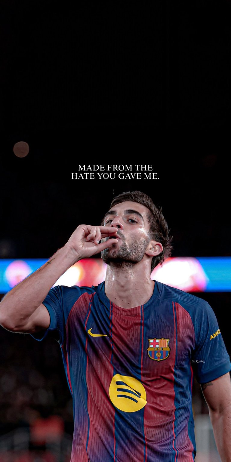 A high-impact 3D wallpaper featuring FC Barcelona forward Ferran Torres passionately celebrating a goal or victory, perhaps with a pointed gesture to the crowd. Torres is wearing the club's iconic kit in a moment of intense focus and emotion. The provocative and self-empowering quote, "MADE FROM THE HATE YOU GAVE ME," speaks to overcoming adversity and silencing critics. A powerful choice for determined fans of Barça.