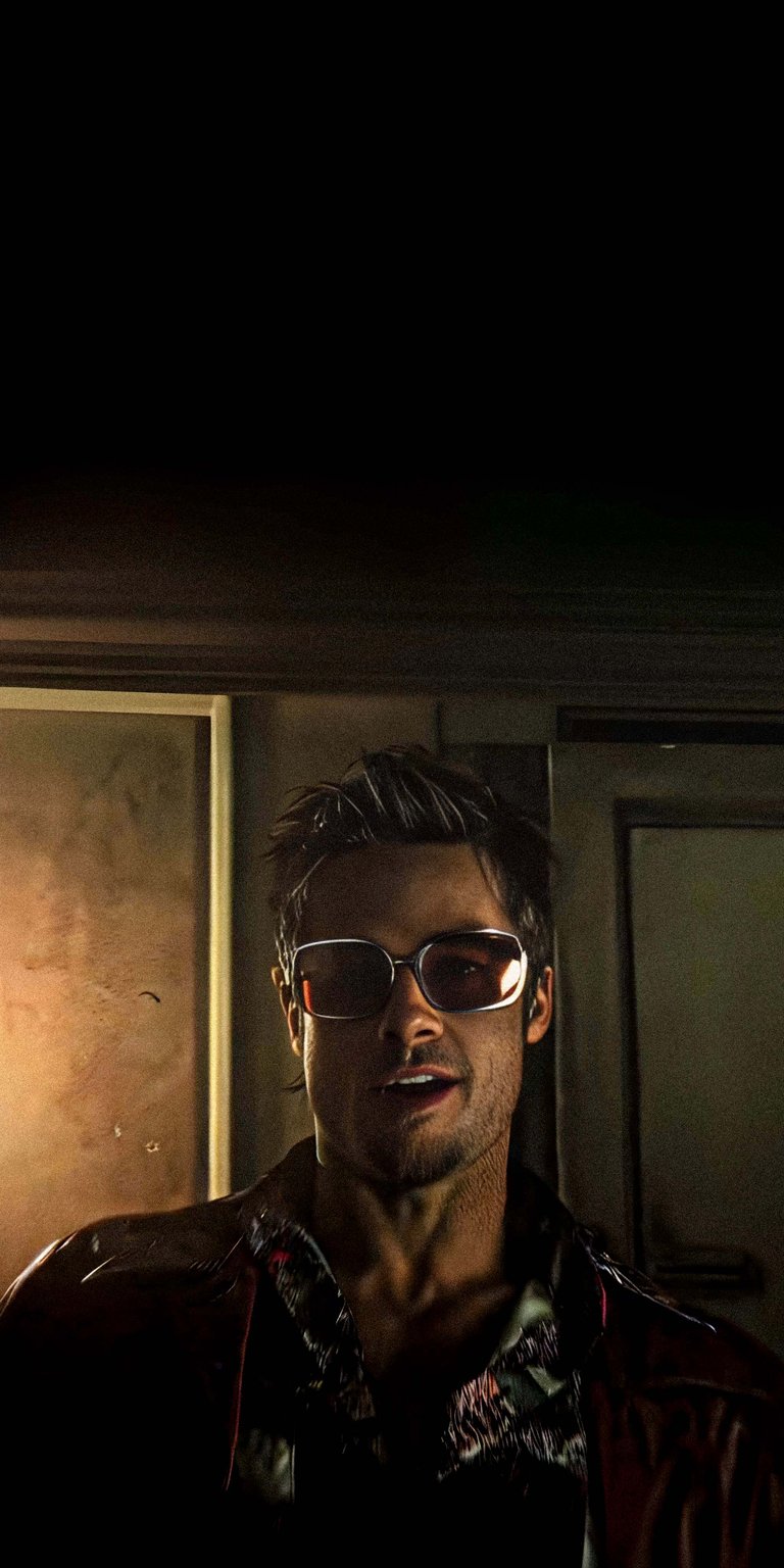 A gritty, high-definition shot of Tyler Durden (Brad Pitt) sporting his iconic red leather jacket and vintage tint sunglasses. The lighting captures the dark, underground atmosphere of the film, highlighting the chaotic charisma of the character. Perfect for fans of 90s cinema and psychological thrillers.