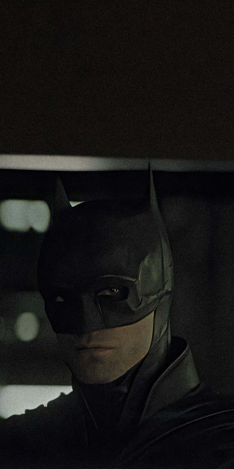 Download this stunning Batman wallpaper in 4K for your iPhone! Featuring a shadowy figure with pointed ears and piercing eyes, this wallpaper captures the essence of the dark knight.