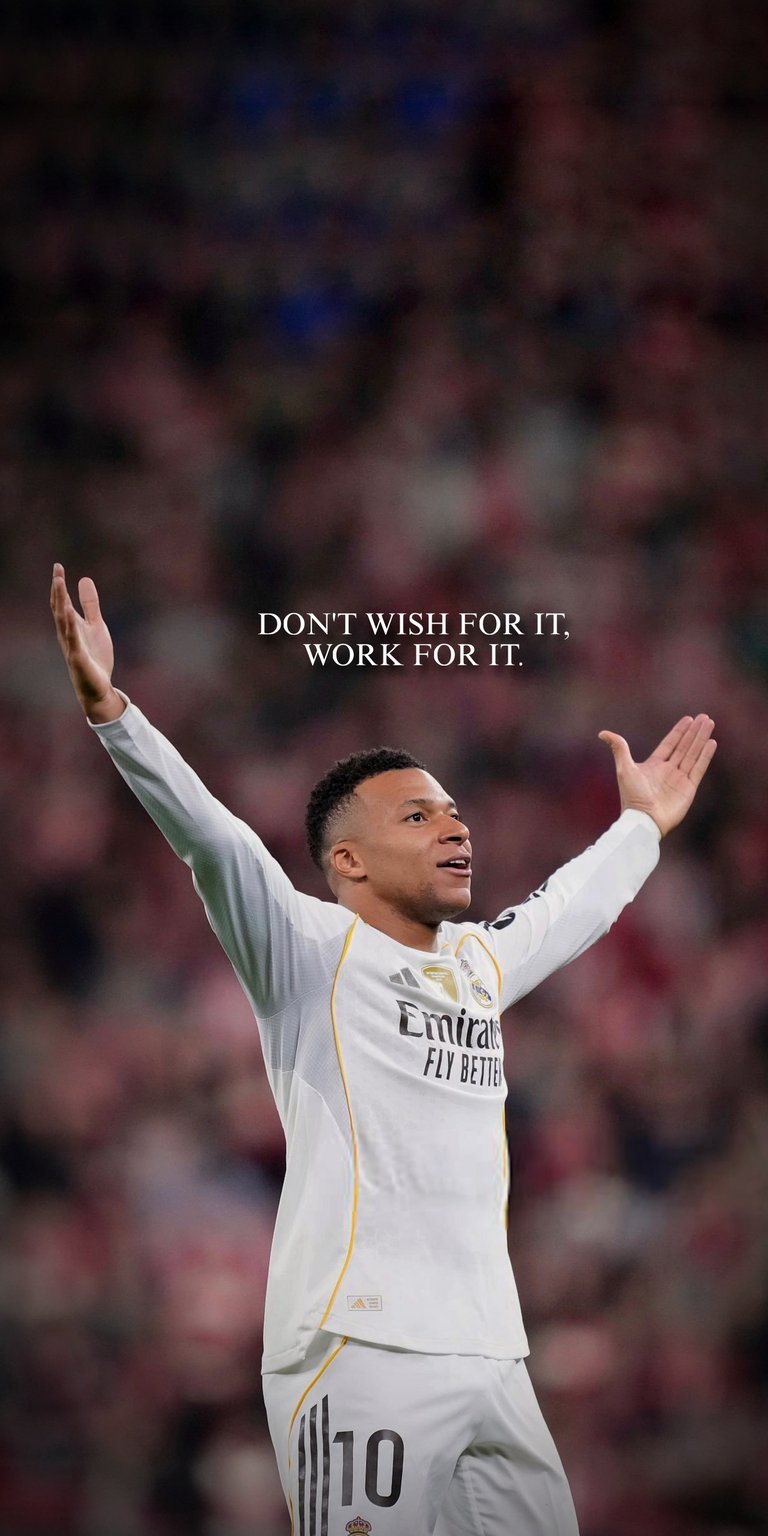 An uplifting 3D wallpaper featuring Real Madrid star Kylian Mbappé celebrating a monumental victory with his arms raised in triumph. The background is a vibrant stadium atmosphere, conveying the emotion of a major match. The inspiring message, "DON'T WISH FOR IT. WORK FOR IT," is a perfect blend of high-level athletic performance and motivational philosophy, ideal for fans of Mbappé and the demanding spirit of Real Madrid.