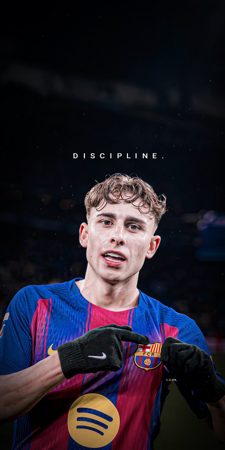 A vibrant 4K wallpaper showcasing FC Barcelona’s Fermín López pointing to the crest in the iconic "Blaugrana" stripes. The image is titled with the word "DISCIPLINE" in a clean, spaced-out font. The high-contrast edit highlights the details of the Nike kit and the player's intense focus, celebrating the discipline required to reach the top of world football.