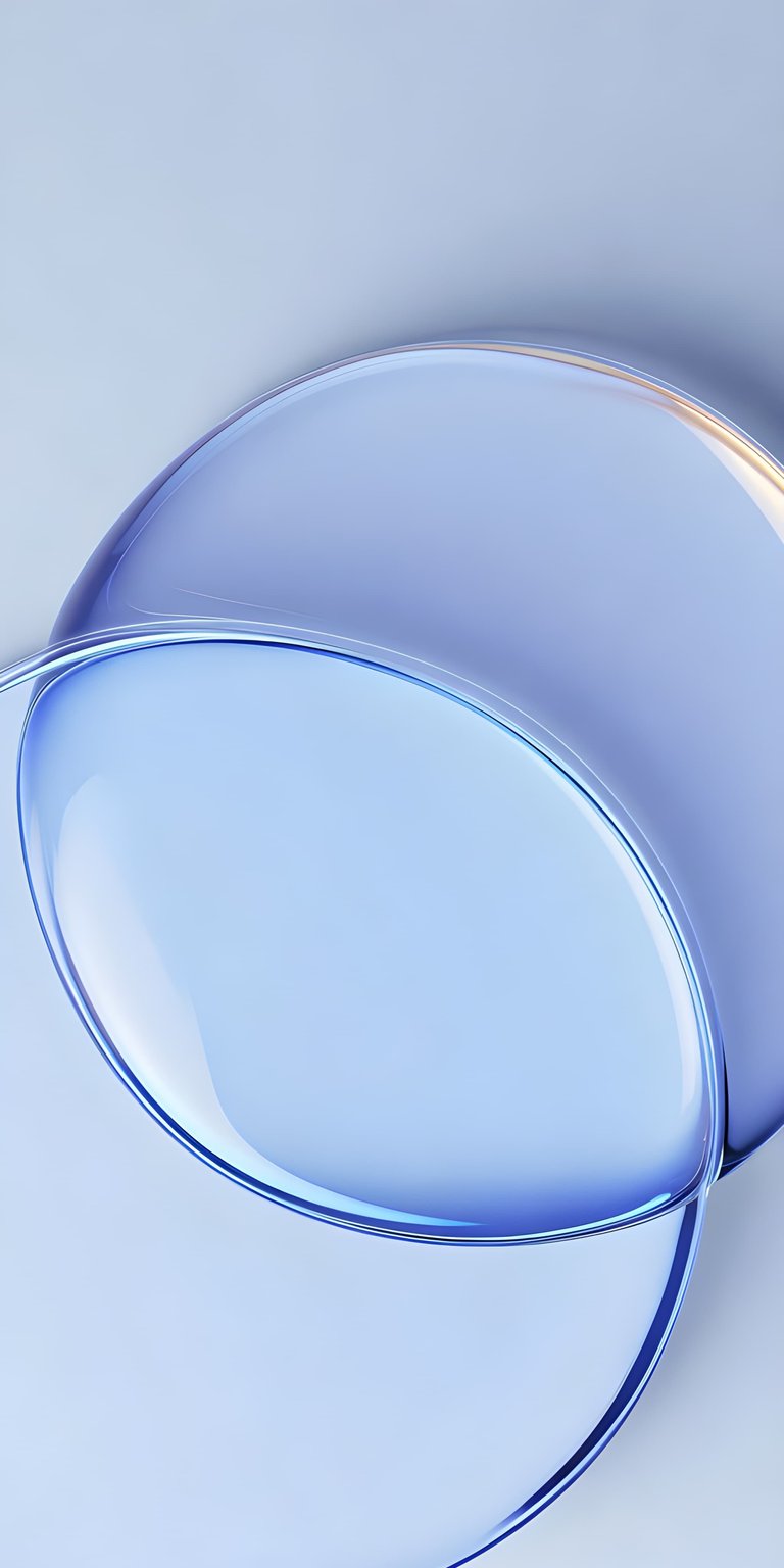 This wallpaper features a series of translucent, overlapping circles and spheres in various shades of pastel blue. The glass-like transparency and soft gradients create a refreshing, liquid-like feel that mimics the look of modern UI design. It provides a bright, airy, and contemporary background that adds a touch of sophistication without being distracting.